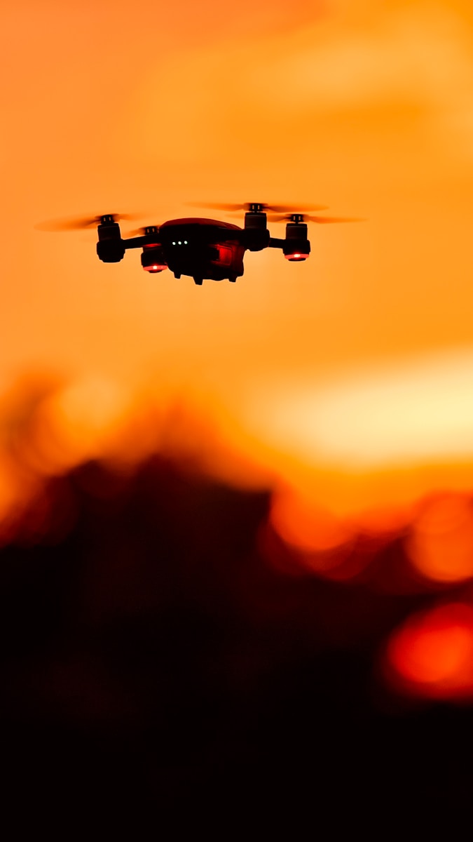 Conflict in Africa: Armed drone flying over African conflict zones symbolizing modern warfare and technological change
