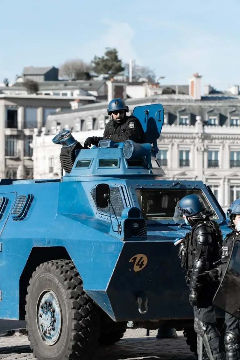 Franklin Transfer : a blue armored vehicle parked in front of a building