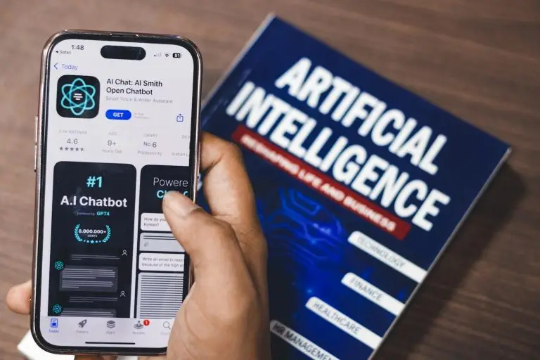 AI Digital Revolution Shapes Express Headlines AI Digital Revolution: Smartphone displaying AI app with book on AI technology in background.