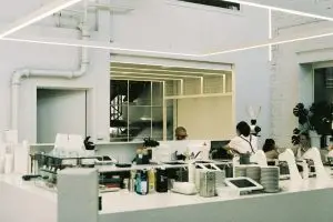 Work Challenges Mauritius: A group of people standing around a kitchen