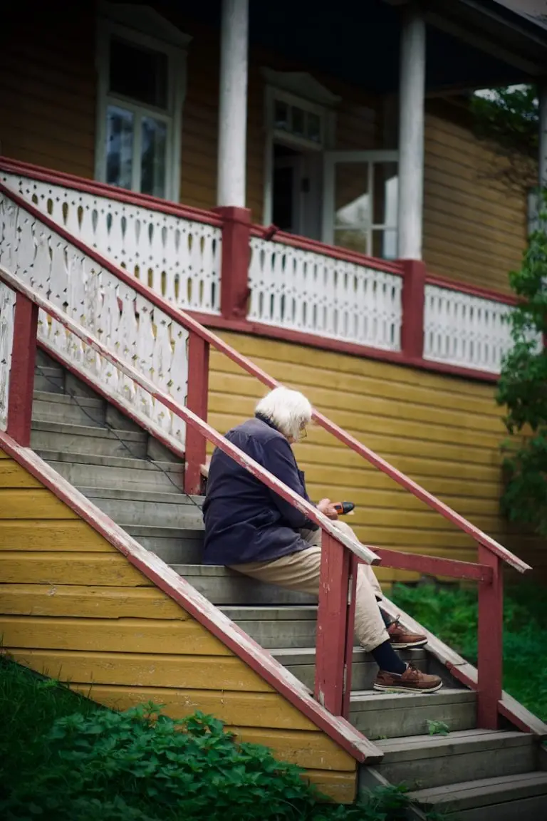 Property fraud Mauritius: A woman sitting on the steps of a house